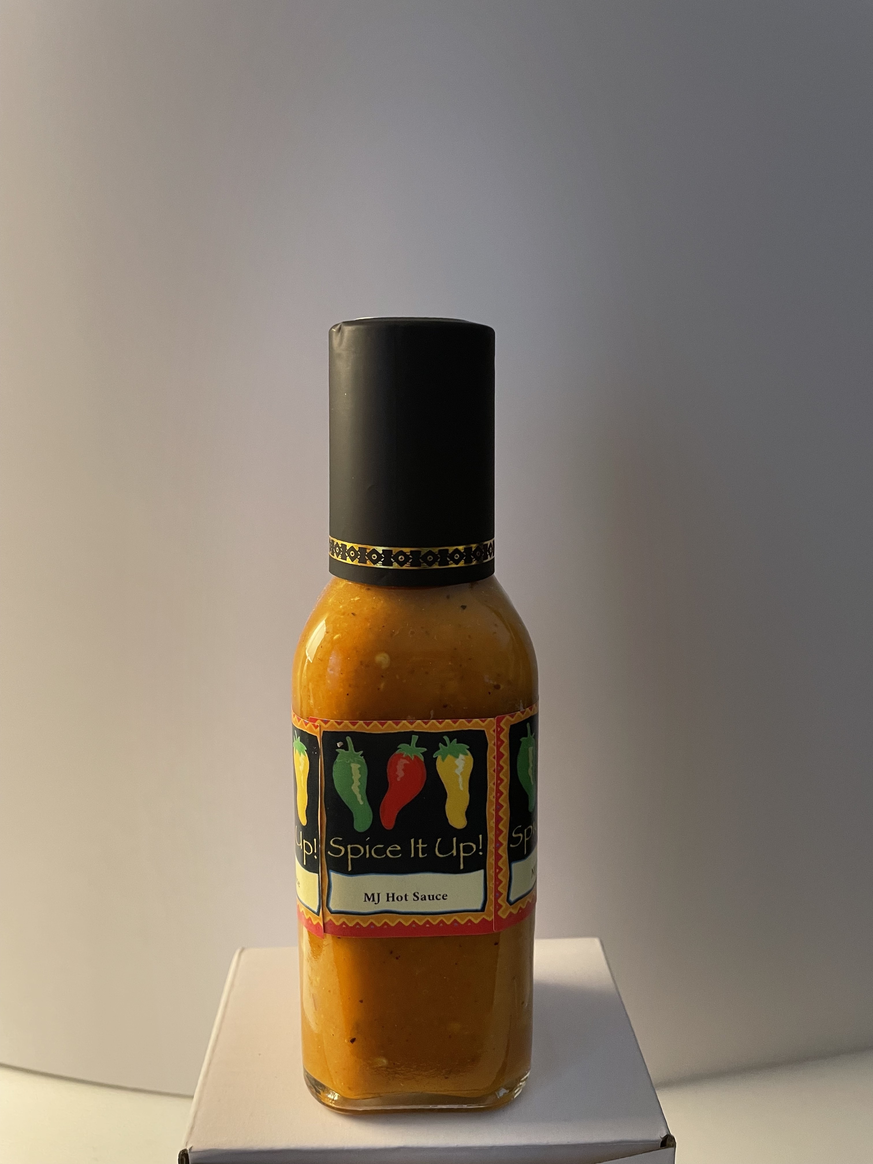 MJ, founder of MJ's Hot Sauce, preparing authentic Caribbean hot sauce with fresh scotch bonnet peppers in her Virgin Islands kitchen